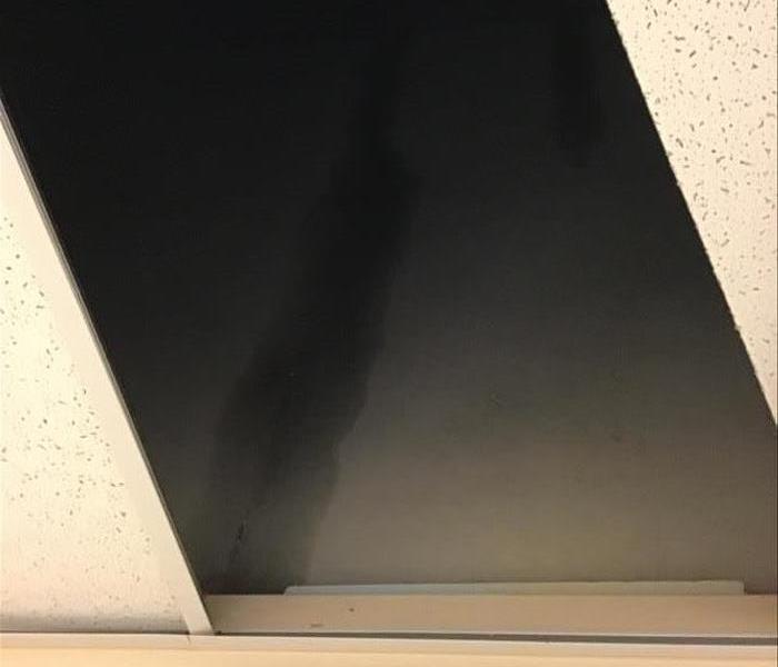 A picture of water damage from a roof leak.