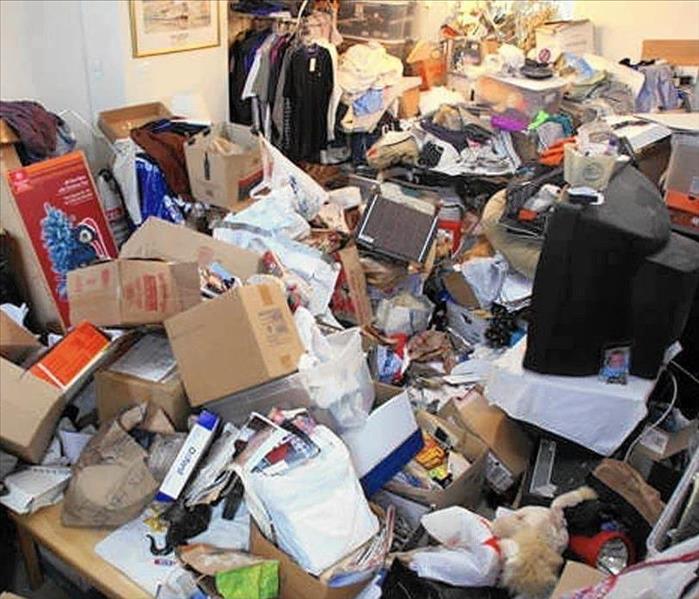 A picture of a room full of clutter.